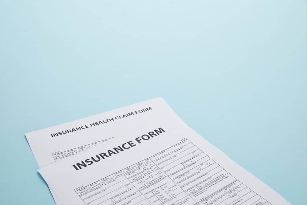 insurance forms on a blue background